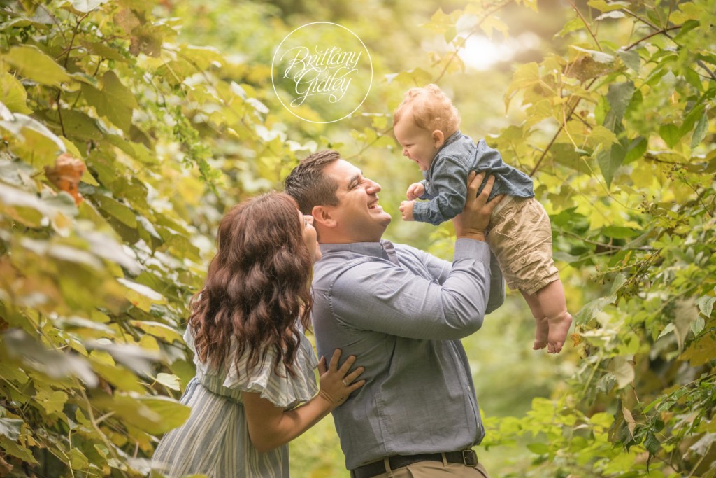 Vineyard Baby Photo Shoot | Medina Baby Photographer | Baby Photography | 12 Month Baby Posing With Family | Start With The Best | www.brittanygidleyphotography.com