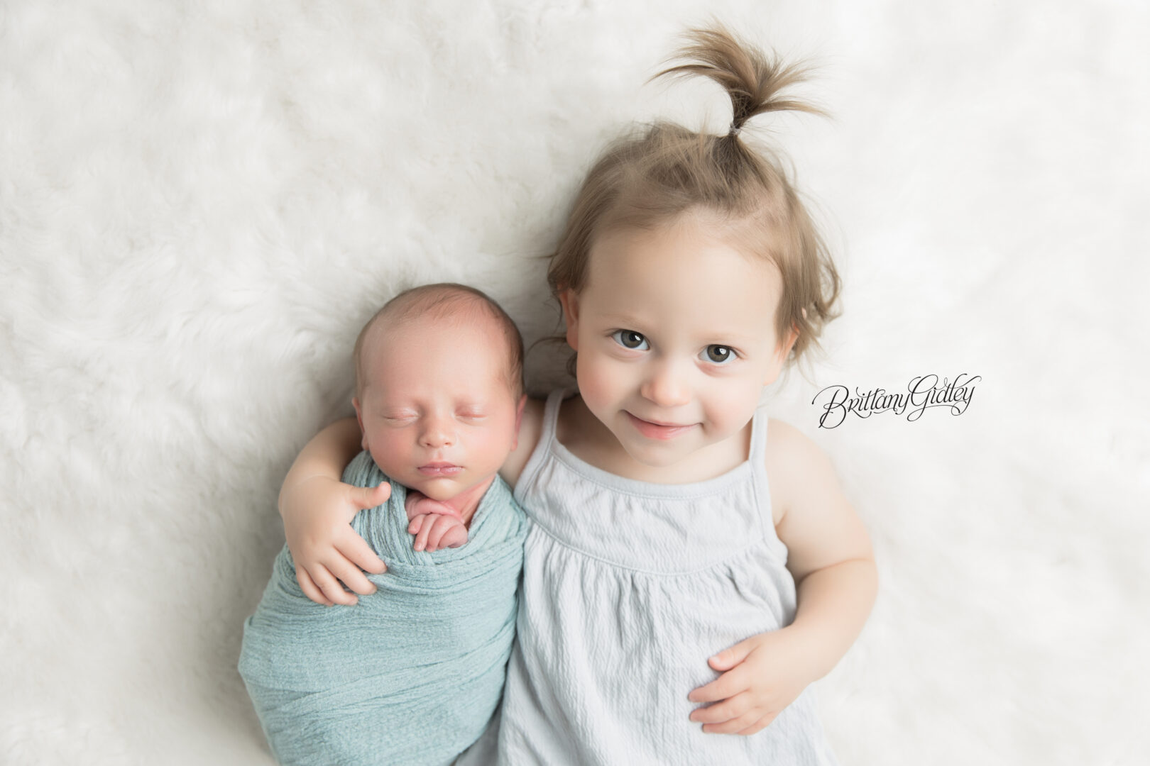 Newborn Baby and Sister