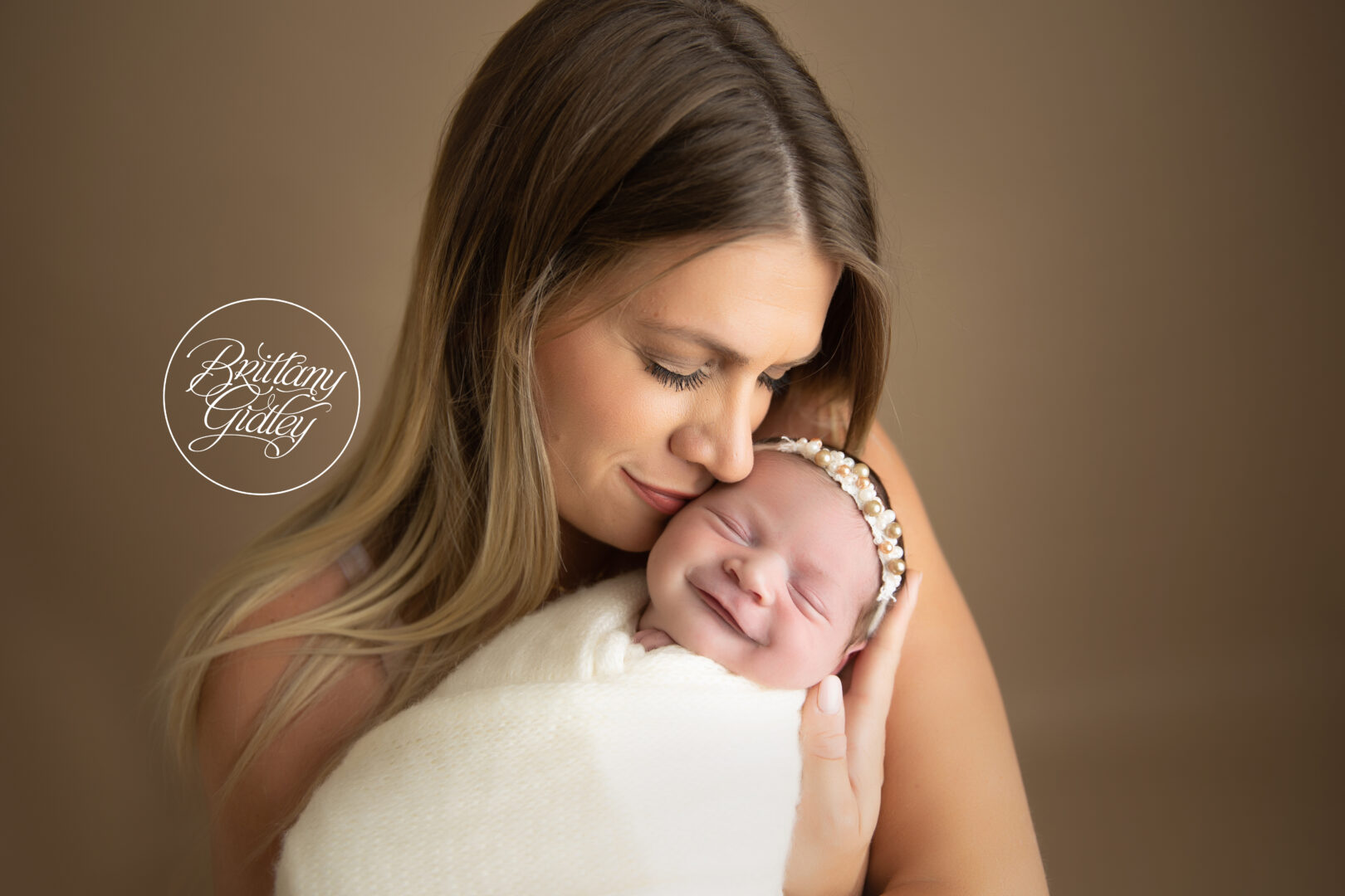 Smiling Newborn with Mother