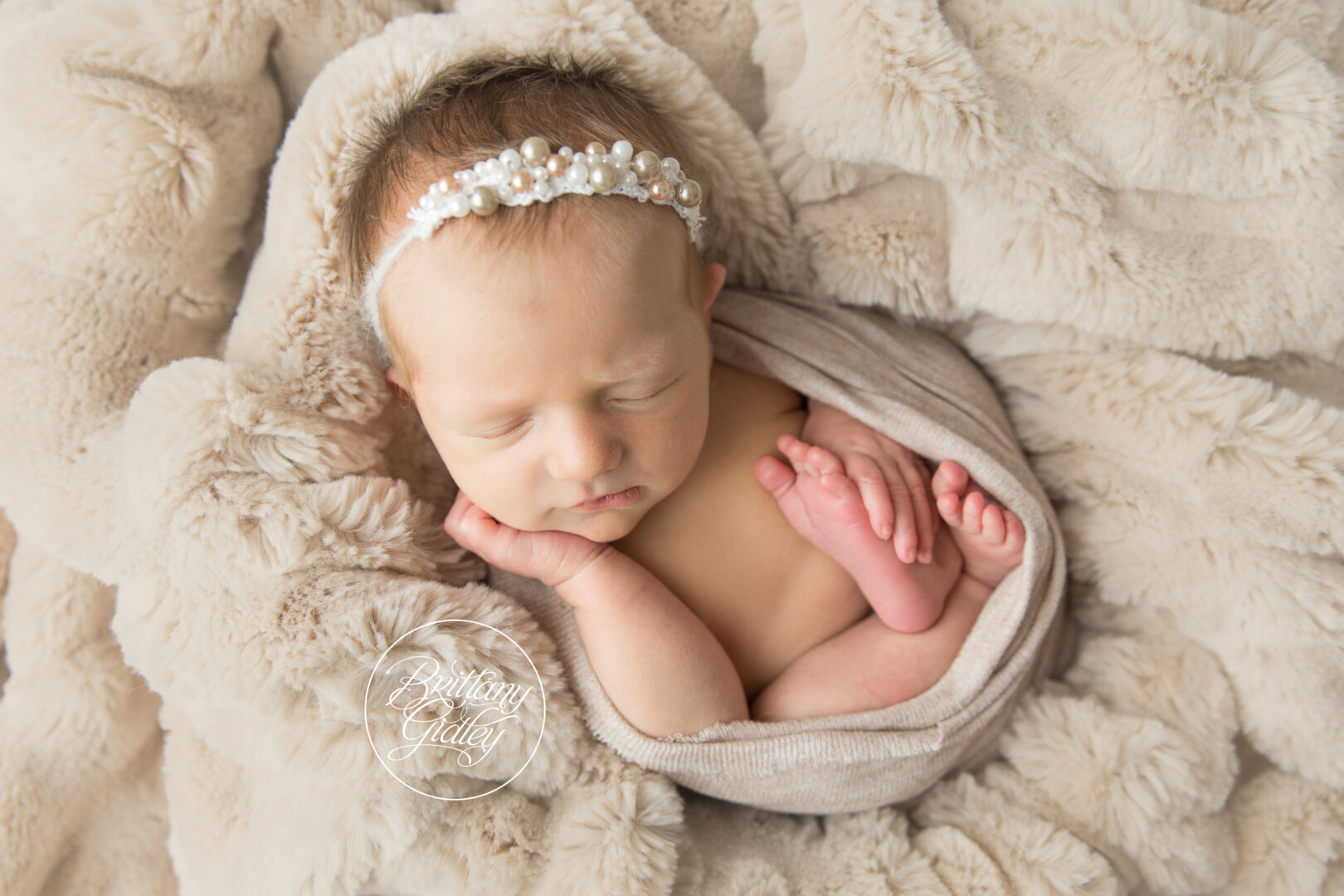 Newborn Sleeping With Wrap and Fur