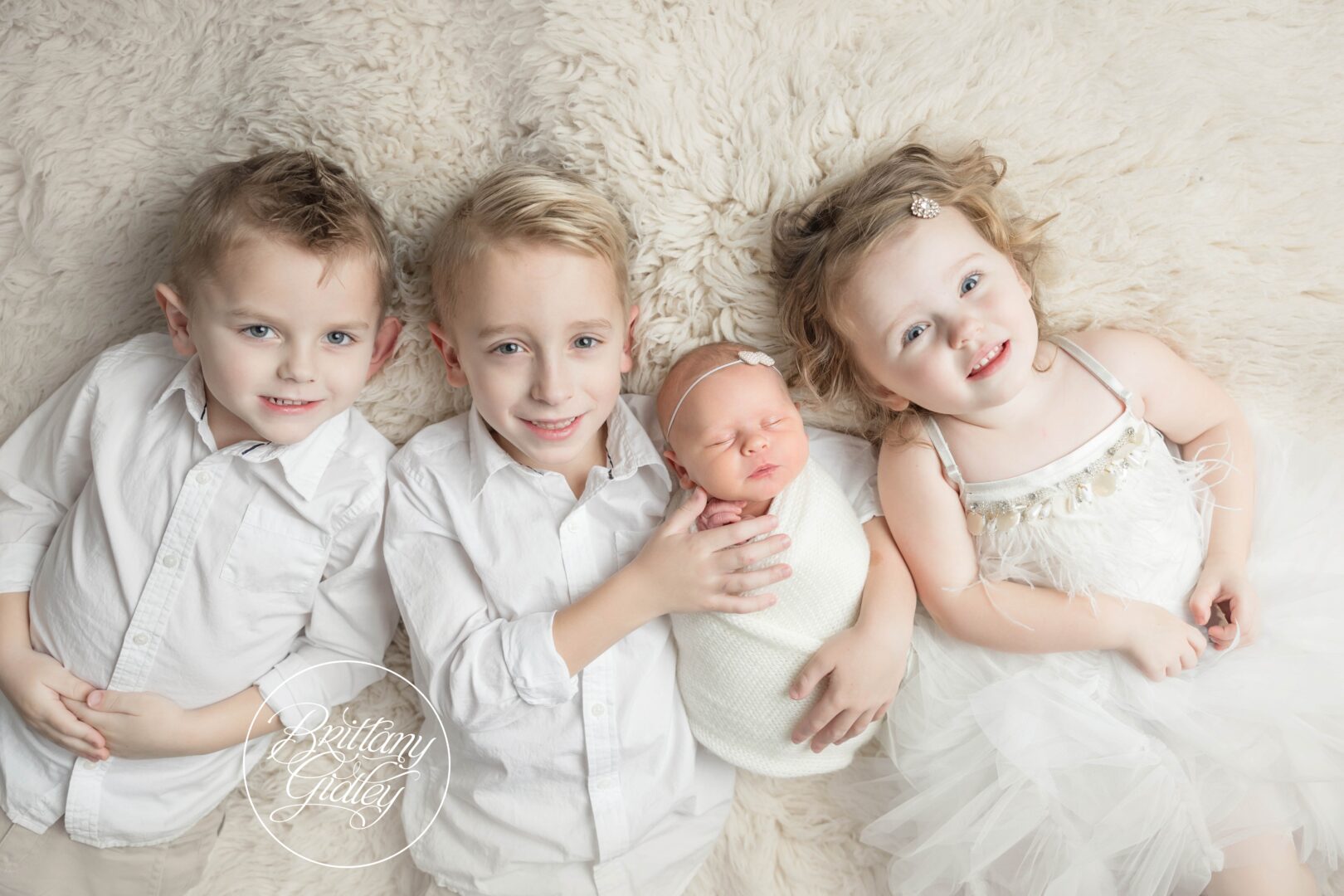 Newborn baby girl with siblings