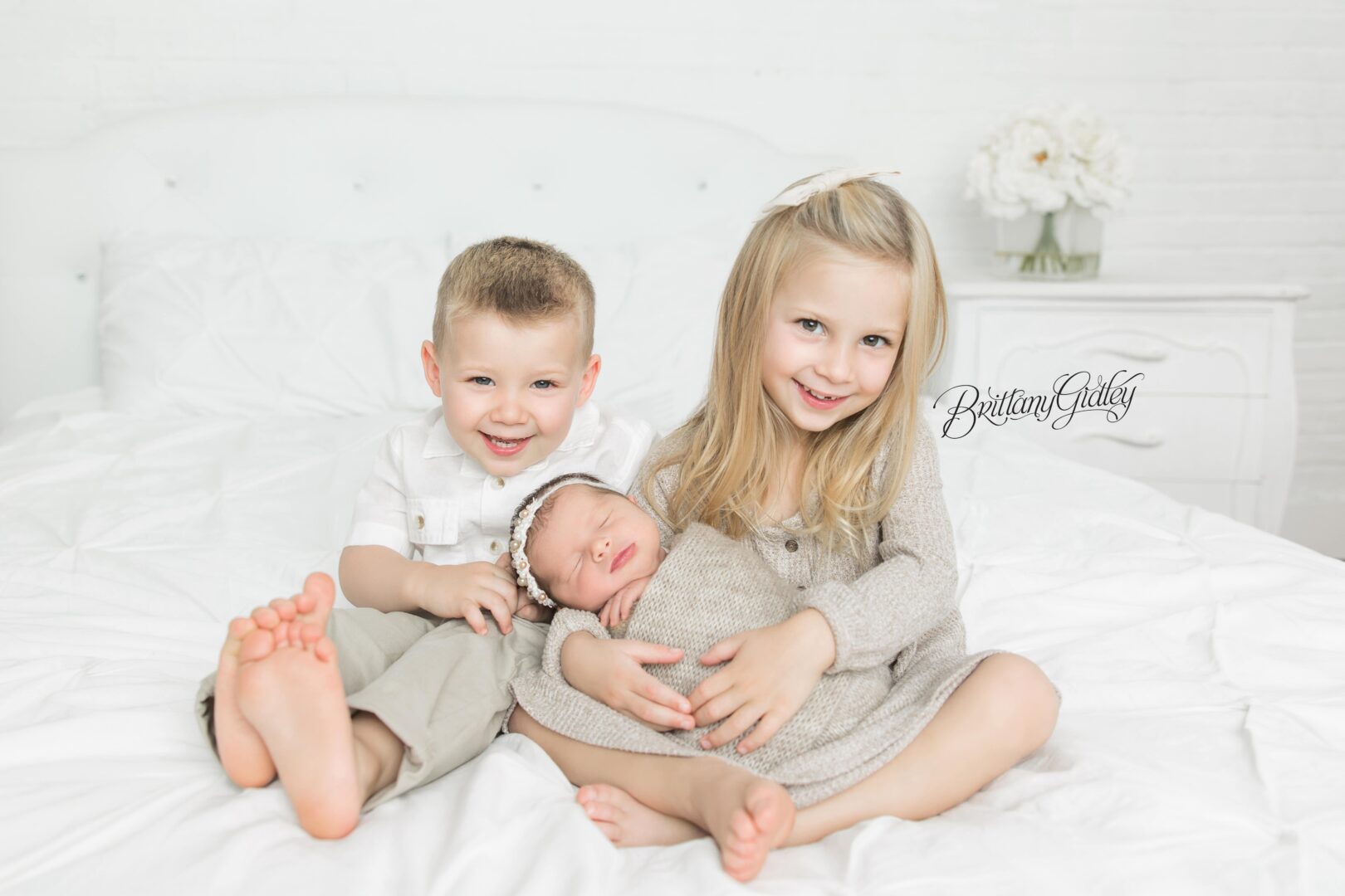Siblings with Baby