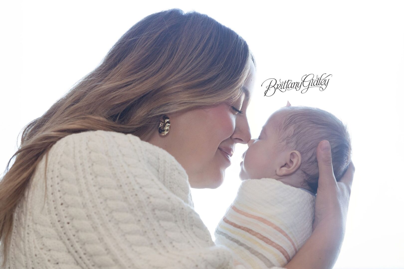 Mom holding newborn Scottie nose to nose in the NICU at Akron Children's