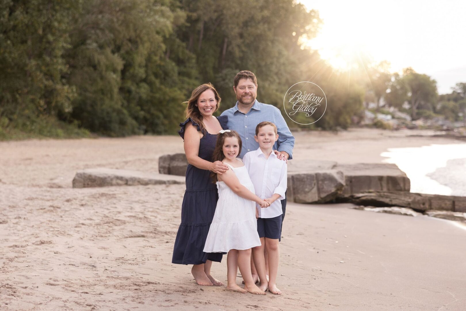 Family portrait on the sand at Huntington Beach with Lake Erie in the background