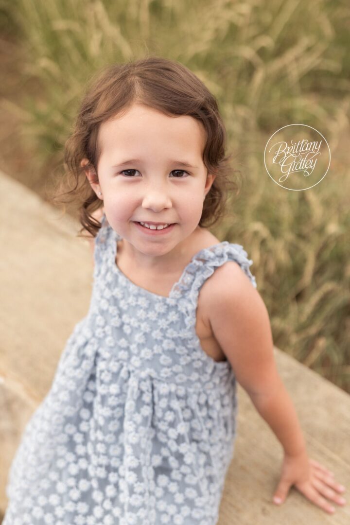 Youngest sister in a blue floral dress at Edgewater Beach