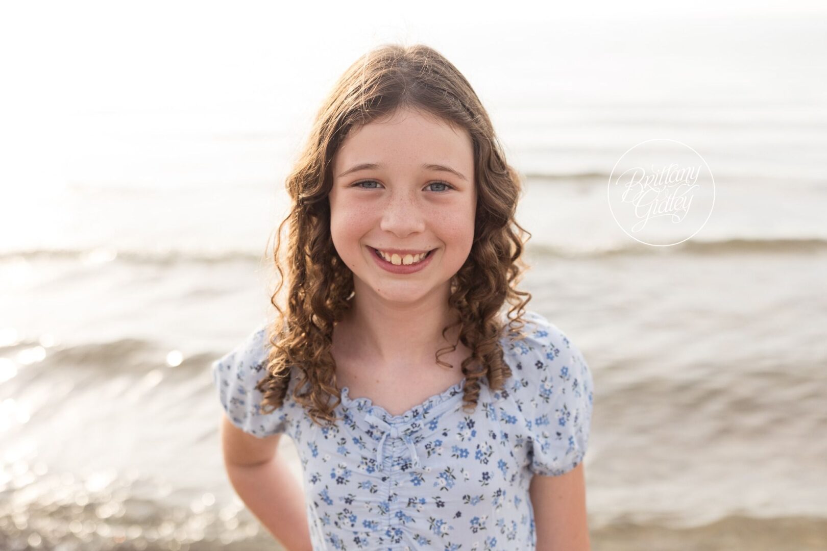 Smiling daughter by the Lake Erie waves